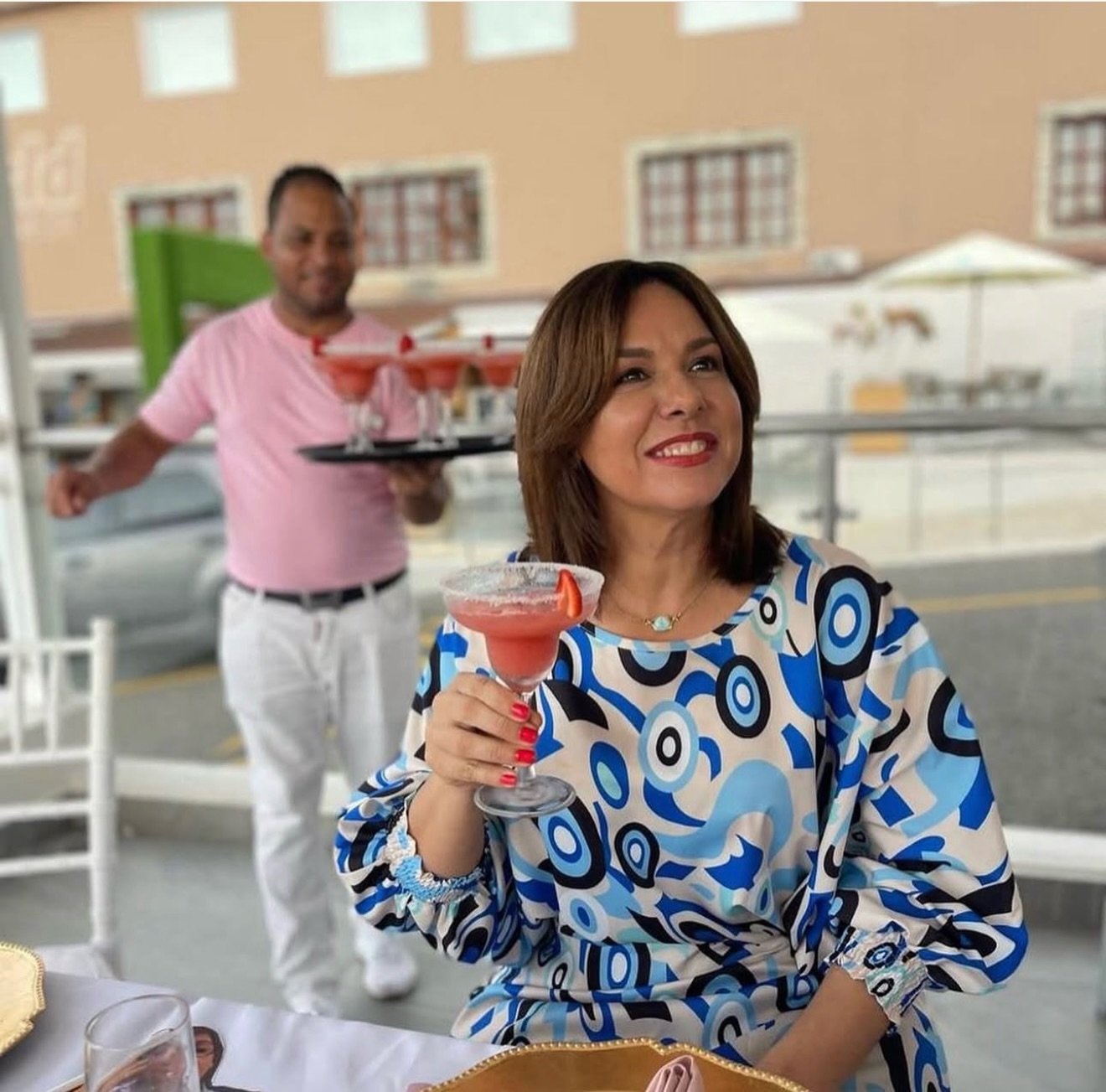 Guest enjoying a cocktail at Ocean World Terrace